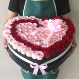 Red and pink Roses in A Heart Shaped Box