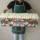 100 white Roses in A long Colorful box