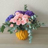 purple hydrangea and pink flowers in A yellow Vase