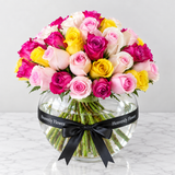 Assorted flowers in a fish bowl vase -