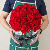 Red roses in a fish bowl vase - Dome shape