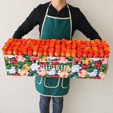 100 orange Roses in A long Colorful box