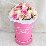 Assorted Flowers in a personalized Pink Round Box