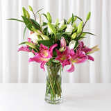 Pink lilies and white roses in a vase