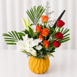 arrangement of red & orange roses in a vase