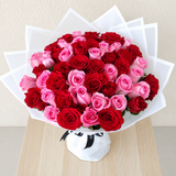 50 Red and Pink Roses with green ruscus