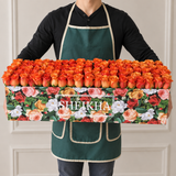 100 orange Roses in A long Colorful box