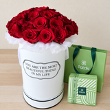 Red roses in a White Round box with chocolate