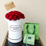 Red roses in a White Round box with chocolate
