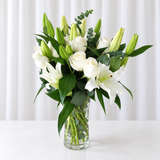 White lilies and white roses in a vase
