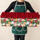 100 Red Roses in A long Colorful box