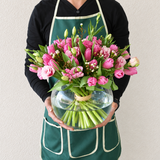 tulips arragemnt in a fish bowl vase