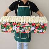 100 white Roses in A long Colorful box