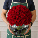 Red roses in a fish bowl vase - Dome shape