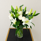 White lilies and white roses in a vase