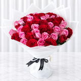 50 Red and Pink Roses with green ruscus