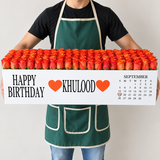 100 orange roses in a white long box
