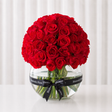 Red roses in a fish bowl vase - Dome shape