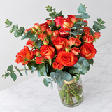 orange flowers in a Glass vase