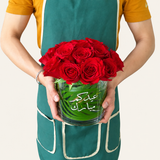Red Roses in a glass cylinder vase