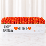 100 orange roses in a white long box