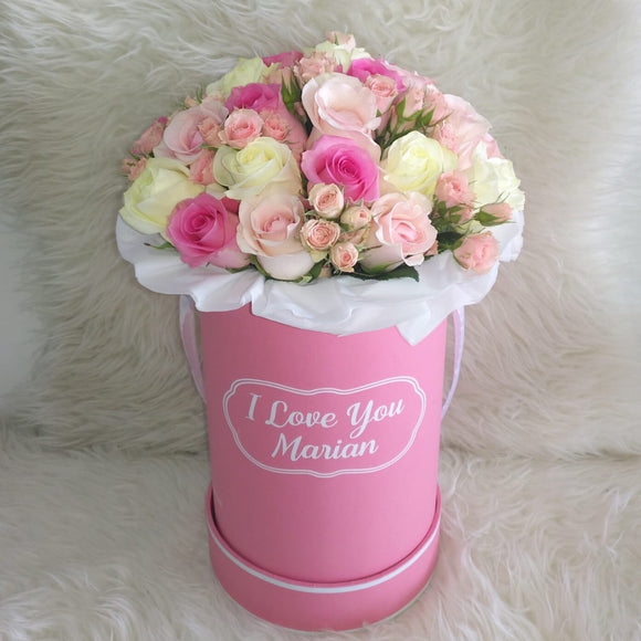 Assorted Flowers in a personalized Pink Round Box