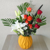 arrangement of red & orange roses in a vase