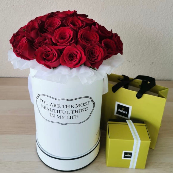 Red roses in a White Round box with chocolate