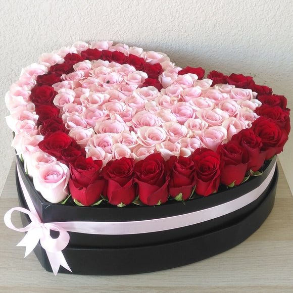 Red and pink Roses in A Heart Shaped Box