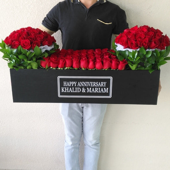 Red Roses in A long black box with 2 round boxes