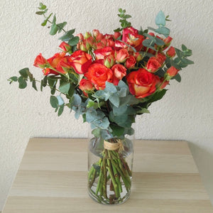 orange flowers in a Glass vase