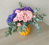 purple hydrangea and pink flowers in A yellow Vase