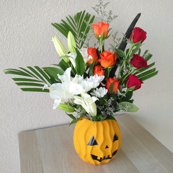 arrangement of red & orange roses in a vase - Halloween