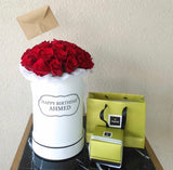 Red roses in a White Round box with chocolate