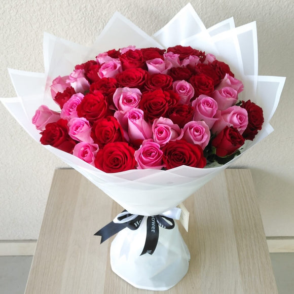 50 Red and Pink Roses with green ruscus