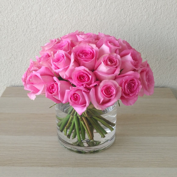 Pink Roses in a Glass Cylinder Vase