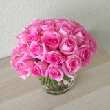 Pink Roses in a Glass Cylinder Vase
